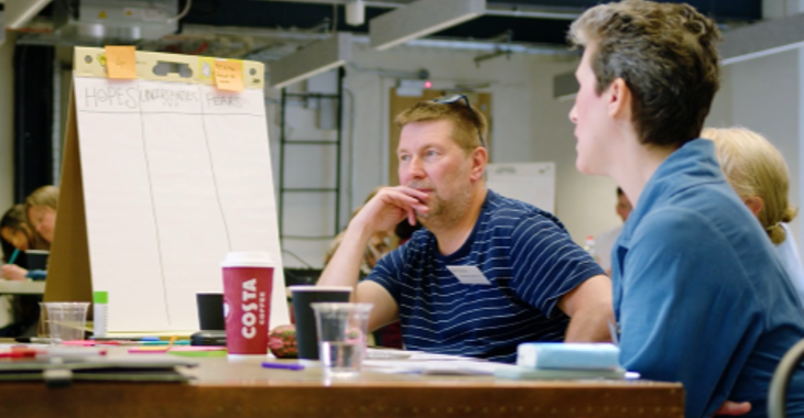 Three People Talk At A Table 500X450