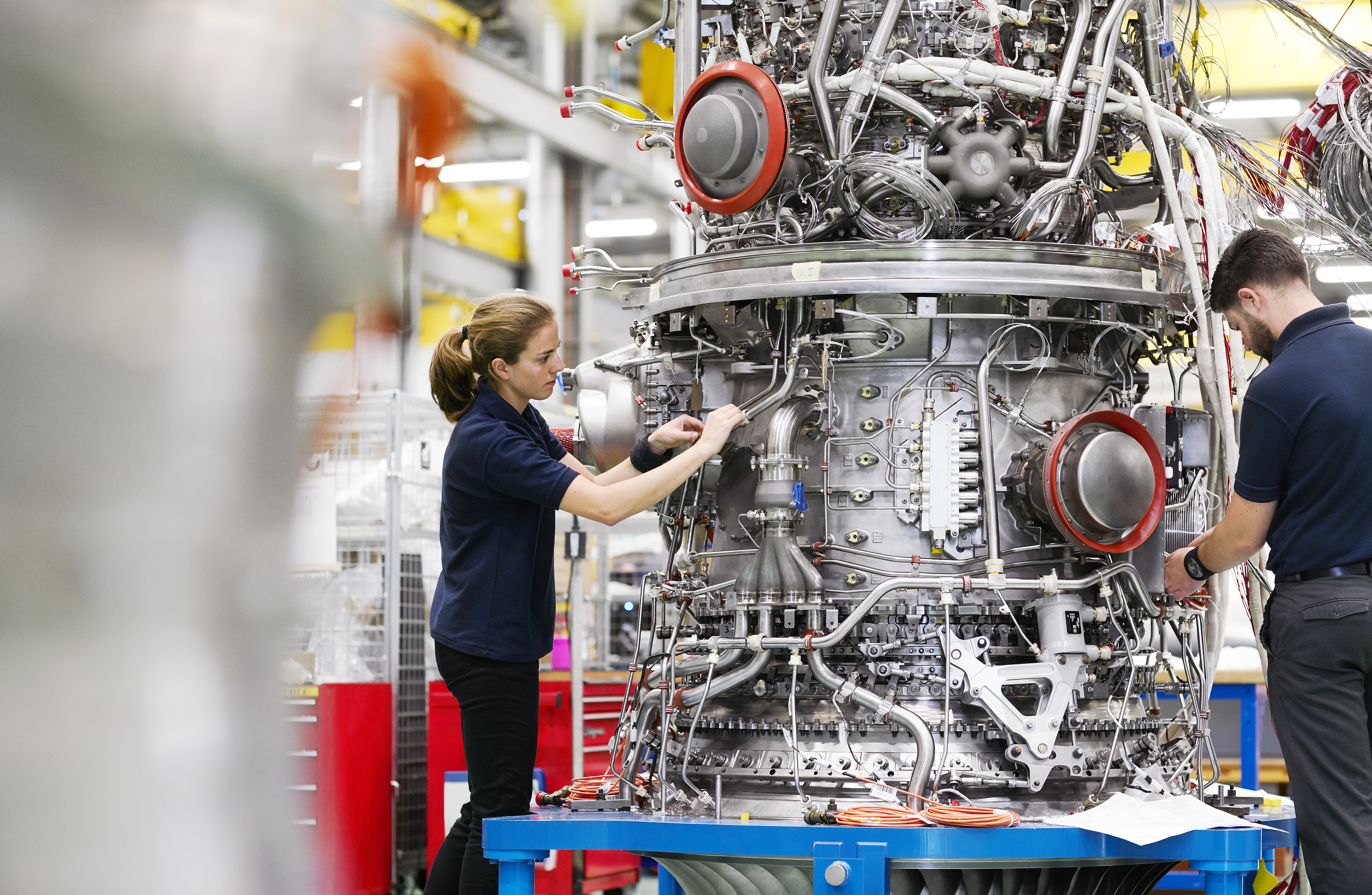Two engineers working on civil aerospace engine Advanced Low Emission Combustion (ALECSYS), in Bristol, United Kingdom